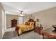 Well-appointed bedroom with a decorative bed, side tables, and dresser at 728 Palmers Pl, Rock Hill, SC 29730