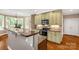 Updated kitchen with stone countertops, modern appliances, and bright breakfast area at 728 Palmers Pl, Rock Hill, SC 29730
