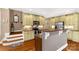Stylish kitchen featuring custom cabinets, granite counters, and a breakfast bar at 728 Palmers Pl, Rock Hill, SC 29730