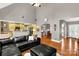 The open living space features hardwood floors, a high ceiling, with a seamless transition to the adjacent kitchen and dining areas at 728 Palmers Pl, Rock Hill, SC 29730