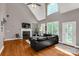 Bright living room featuring a fireplace, hardwood floors, and large windows at 728 Palmers Pl, Rock Hill, SC 29730