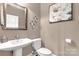 Stylish powder room with pedestal sink, toilet, and elegant decor at 728 Palmers Pl, Rock Hill, SC 29730
