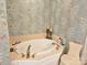 Corner bathtub with jets surrounded by wallpapered walls and warm tones creating a relaxing atmosphere at 800 Warrington Pl, Rock Hill, SC 29732