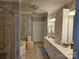 Detailed bathroom with patterned wallpaper, tile floor, shower and vanity area at 800 Warrington Pl, Rock Hill, SC 29732
