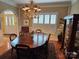Elegant dining room with hardwood floors and a large window with shutters at 800 Warrington Pl, Rock Hill, SC 29732