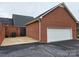 Brick home with a detached garage and well-maintained exterior at 800 Warrington Pl, Rock Hill, SC 29732