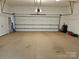 Clean, spacious garage featuring a sealed floor, ample storage, and access to the rest of the house at 800 Warrington Pl, Rock Hill, SC 29732