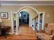 Elegant living room featuring hardwood floors, arched entryways, and stairway at 800 Warrington Pl, Rock Hill, SC 29732