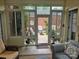 Bright sunroom with views of the outdoor patio and lush greenery at 800 Warrington Pl, Rock Hill, SC 29732