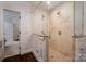 Luxurious shower featuring glass enclosure and dual shower heads, seamlessly integrated into bathroom design at 8028 Water View Dr, Belmont, NC 28012