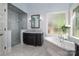 Elegant bathroom featuring a glass shower, soaking tub, and marble countertops at 8028 Water View Dr, Belmont, NC 28012