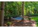 Tranquil backyard featuring a hammock strung between trees in a landscaped yard at 8028 Water View Dr, Belmont, NC 28012