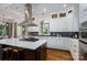 Gourmet kitchen with a center island, stainless steel appliances, and custom cabinetry at 8028 Water View Dr, Belmont, NC 28012