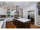 Spacious kitchen features a large island with cooktop, stainless steel appliances, and ample storage at 8028 Water View Dr, Belmont, NC 28012