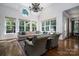 Open living room with large windows, hardwood floors and comfortable seating at 8028 Water View Dr, Belmont, NC 28012