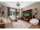 Inviting living room featuring vaulted ceiling, a large window, and comfortable seating arrangement at 8028 Water View Dr, Belmont, NC 28012