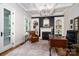 Sophisticated home office features custom built-ins, a cozy fireplace, and elegant finishes at 8028 Water View Dr, Belmont, NC 28012