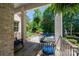 Inviting covered patio with comfortable seating overlooking the pool and lush backyard at 8028 Water View Dr, Belmont, NC 28012