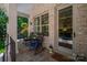 Charming front porch featuring comfortable seating and lovely views of the landscaped front yard at 8028 Water View Dr, Belmont, NC 28012