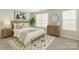 Cozy bedroom showcasing a wood-frame bed, soft bedding, and bright natural light from large windows at 8177 Millwright Ln, Charlotte, NC 28277