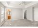A large bedroom with windows and an open doorway to the bathroom and closet at 8177 Millwright Ln, Charlotte, NC 28277