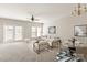 Open-concept living and dining area with plush seating, modern lighting, and lots of natural light at 8177 Millwright Ln, Charlotte, NC 28277