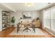 Well-lit home office features sleek desk, bright windows, and stylish storage solutions at 8177 Millwright Ln, Charlotte, NC 28277