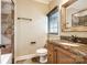 Well-lit bathroom featuring granite countertops and decorative fixtures at 8239 Victoria Lake Dr, Waxhaw, NC 28173