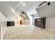 Bright bonus room featuring a wet bar, carpet flooring and ample space at 8239 Victoria Lake Dr, Waxhaw, NC 28173