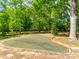 Park area with an open recreation space surrounded by trees at 8239 Victoria Lake Dr, Waxhaw, NC 28173