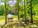 Scenic view of pond with a fountain, bench, and picnic tables at 8239 Victoria Lake Dr, Waxhaw, NC 28173
