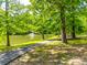 Walking path along the pond with a fountain at 8239 Victoria Lake Dr, Waxhaw, NC 28173
