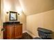 Stylish powder room featuring a granite countertop and decorative fixtures at 8239 Victoria Lake Dr, Waxhaw, NC 28173