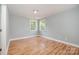 Bright bedroom with hardwood floors, fresh paint and dual windows overlooking the beautiful landscape at 9066 Tulagi Ct, Tega Cay, SC 29708
