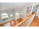 Foyer featuring two-story height, hardwood floors, and many windows at 9066 Tulagi Ct, Tega Cay, SC 29708