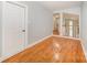 Hallway featuring hardwood floors and fresh paint at 9066 Tulagi Ct, Tega Cay, SC 29708