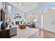 Bright living room with high ceilings, fireplace, modern furniture, and large arched windows with great views at 9066 Tulagi Ct, Tega Cay, SC 29708