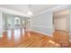 Bright living room with hardwood floors, arched windows and fresh paint with stairs leading to the next level at 9066 Tulagi Ct, Tega Cay, SC 29708