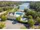 Beautiful community pool, playground, clubhouse, and surrounding landscape with ample parking at 9066 Tulagi Ct, Tega Cay, SC 29708