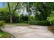 Spacious backyard featuring a mix of greenery and a large concrete patio at 920 Queens Rd, Charlotte, NC 28207