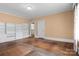 A well lit bedroom with hardwood floors, neutral paint color and built in shelving at 920 Queens Rd, Charlotte, NC 28207