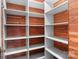 Walk-in closet with custom shelving and cedar wood panels at 920 Queens Rd, Charlotte, NC 28207