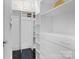 Walk-in closet with custom shelving, drawers, and cabinets at 920 Queens Rd, Charlotte, NC 28207