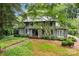 Charming two-story home with a beautifully landscaped front yard and mature trees at 920 Queens Rd, Charlotte, NC 28207