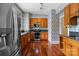 Traditional kitchen features wood cabinets, stainless steel appliances, granite counters and hardwood floors at 920 Queens Rd, Charlotte, NC 28207