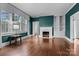 Inviting living room with fireplace, hardwood floors, and large windows at 920 Queens Rd, Charlotte, NC 28207