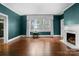 Classic living room featuring a fireplace, hardwood floors and natural light at 920 Queens Rd, Charlotte, NC 28207