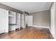 A living room with built-in shelving, hardwood floors and neutral paint color with bright white trim at 920 Queens Rd, Charlotte, NC 28207