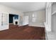 Open room with fireplace, French doors and hardwood floors at 920 Queens Rd, Charlotte, NC 28207