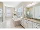 Bright and airy bathroom featuring a soaking tub, double vanities, and a separate glass shower at 1004 Princesa Dr, Matthews, NC 28104